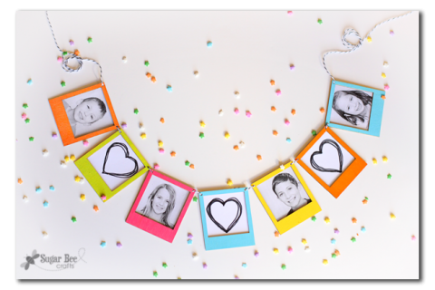 colorful wooden photo frames strung together 