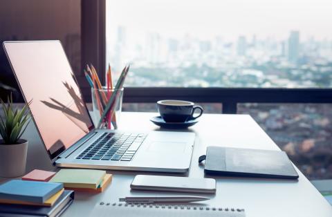 neat and organized desk with computer and stationary