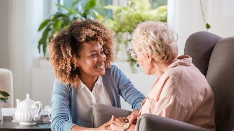 client and caregiver facing each other with calm background