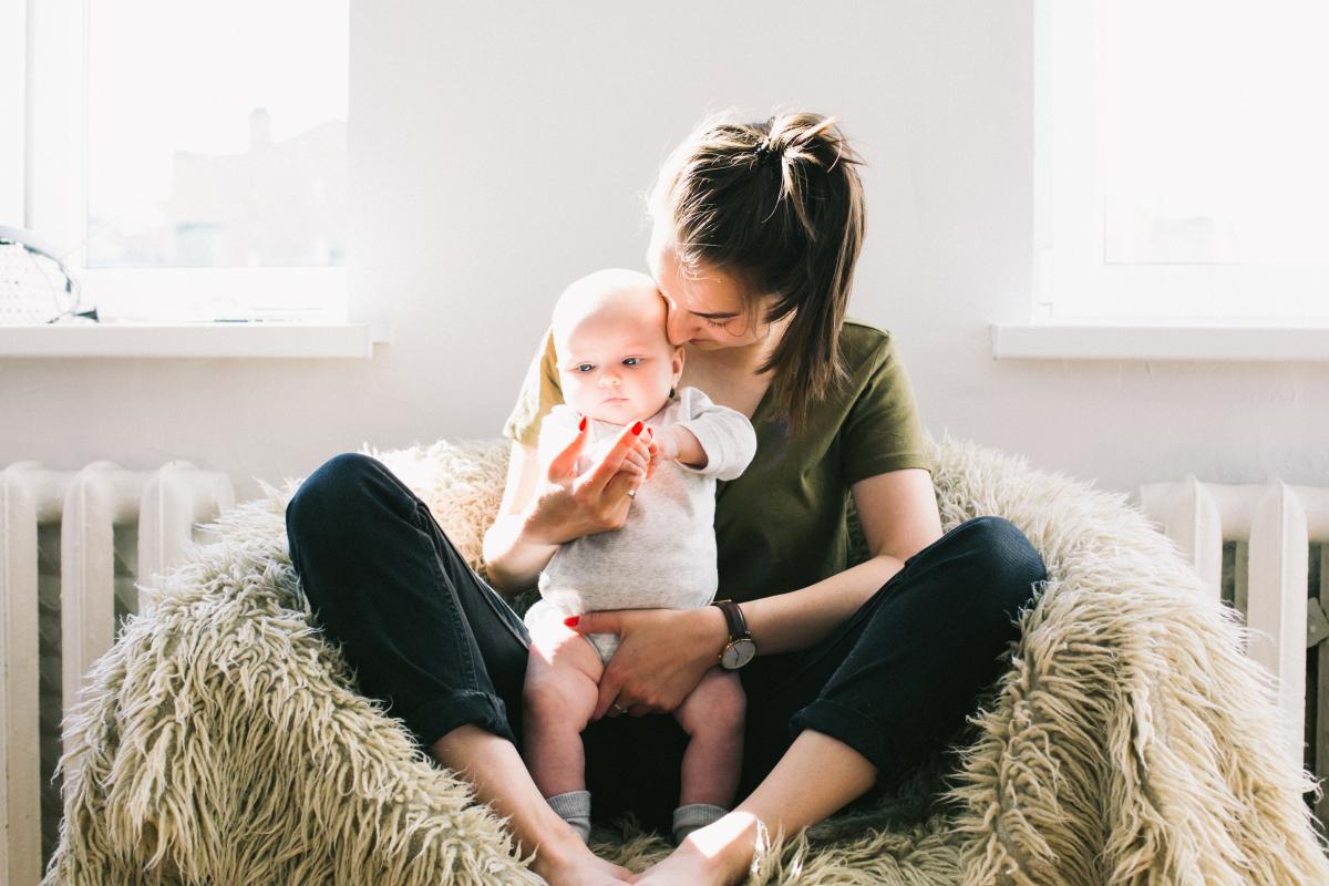 mother holding baby