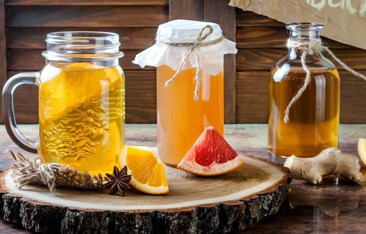 glasses with drinks pieces of fruit and ginger 