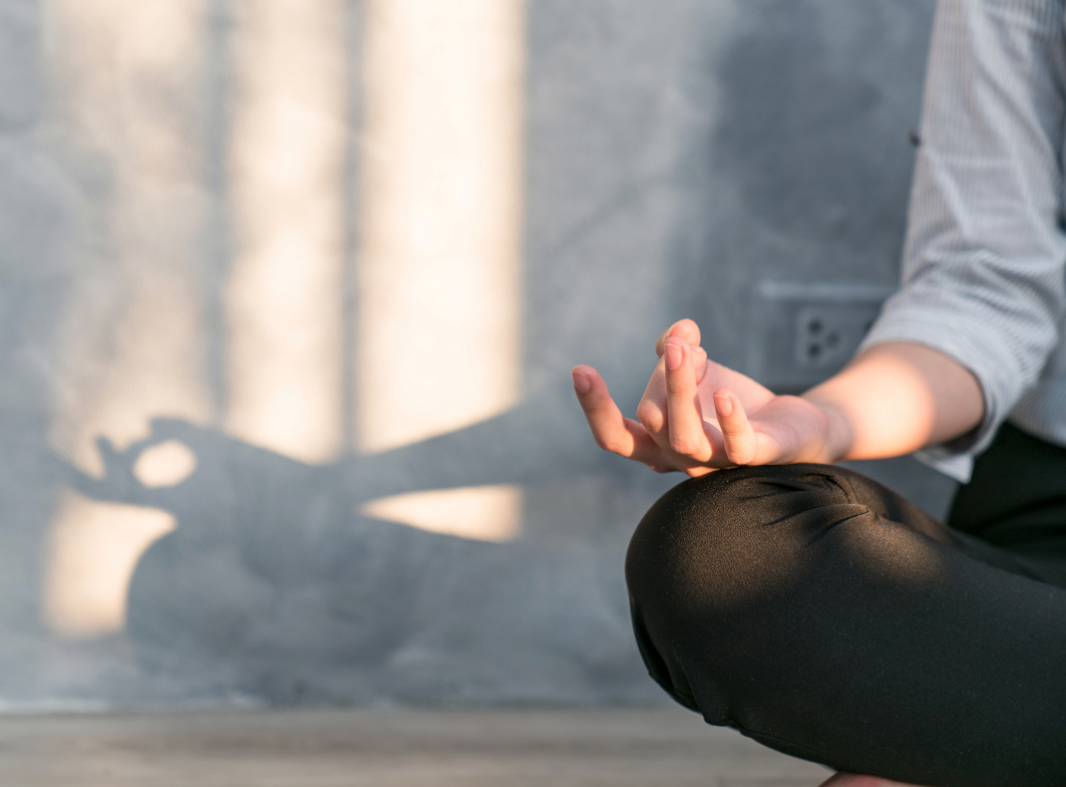 partial image of person in meditative pose