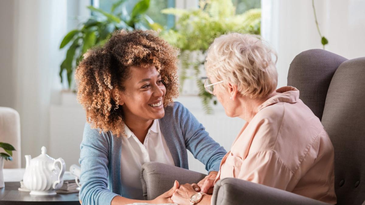 client and caregiver facing each other with calm background