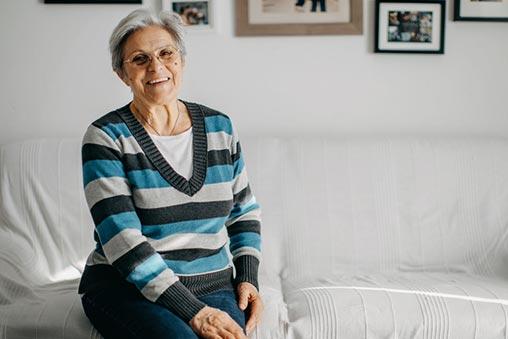 Smiling woman sitting on a sofa