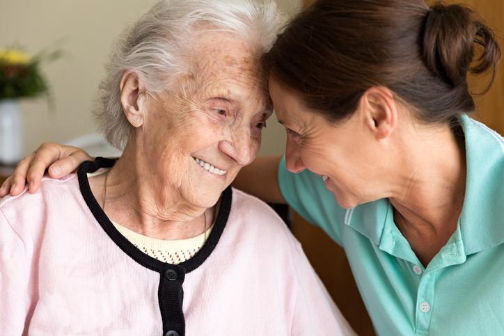 Younger woman comforting an older woman