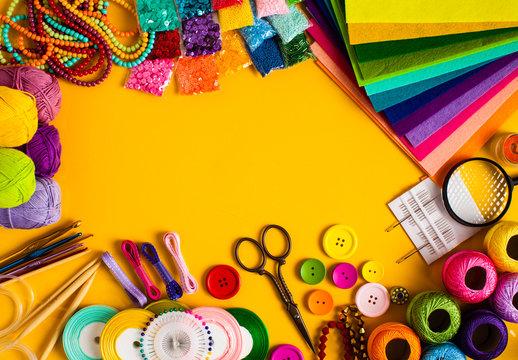 a stock image different crafting supplies over a burnt orange background