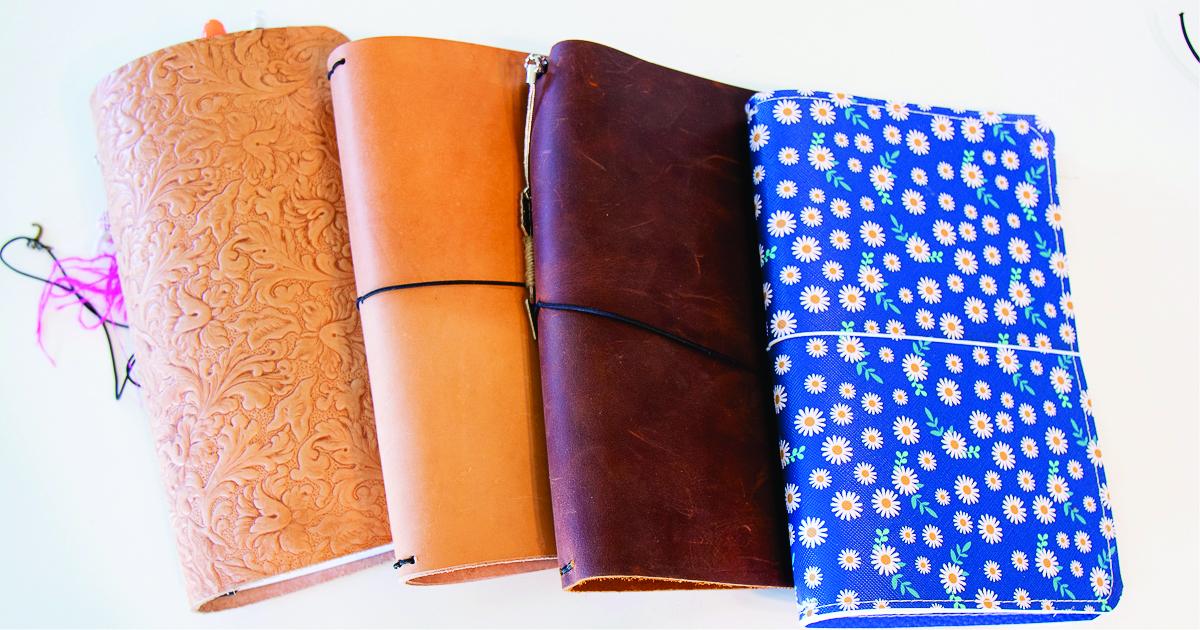 4 faux leather bound travel sized notebooks